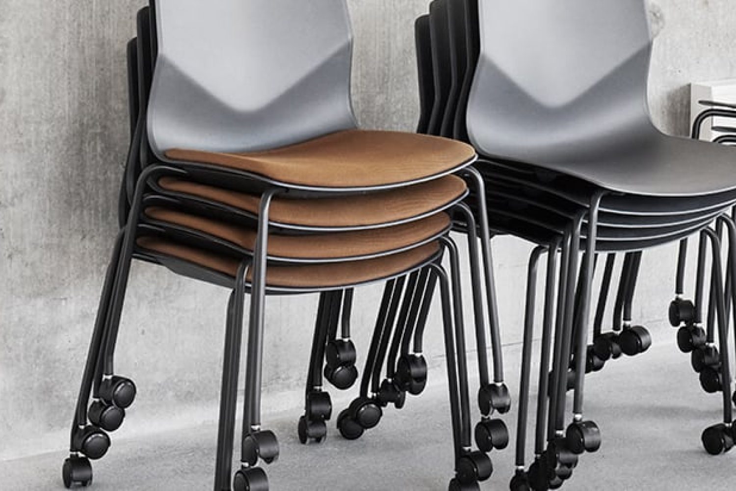 stacked office desk chairs with wheels