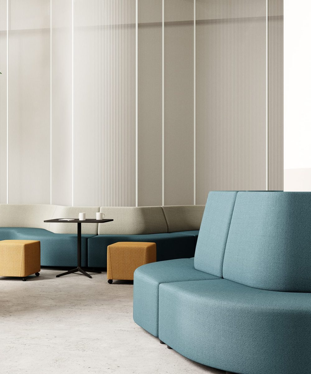 A blue and white office seating area with a plant in the middle.