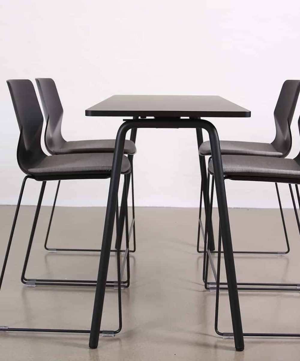 A white table and counter chairs in front of a white wall