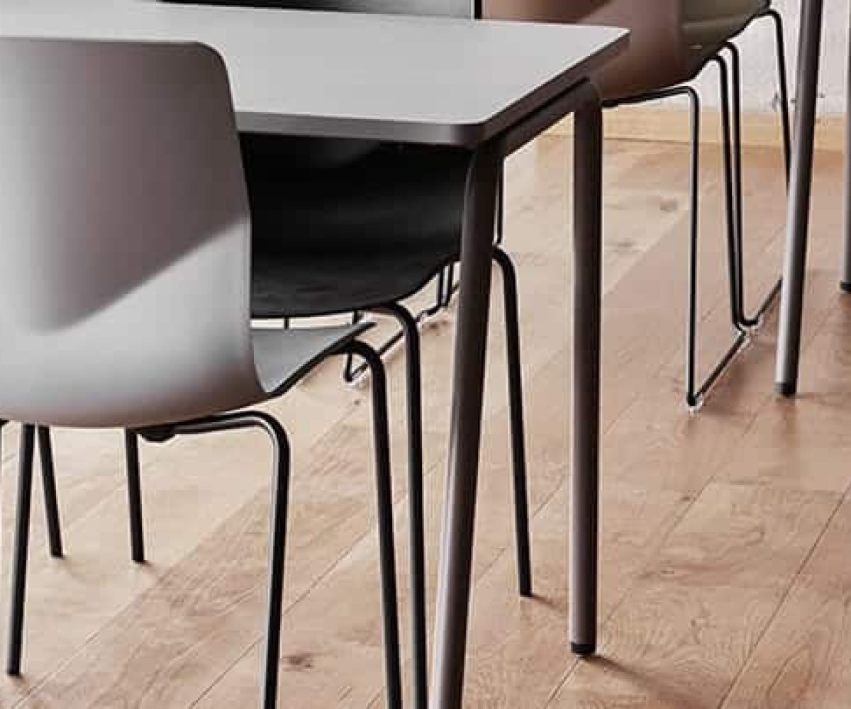 A group of chairs sitting at a table in a classroom.