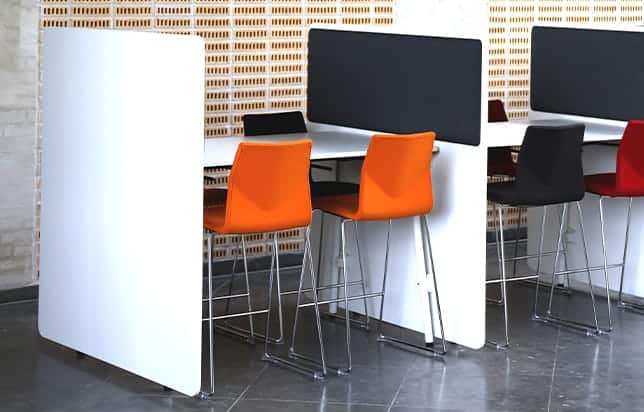 A group of office study tables in a conference room.
