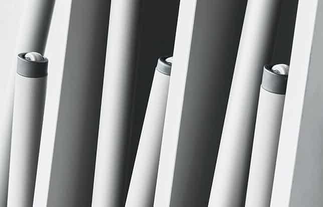 A close up of a row of folded stacked tables