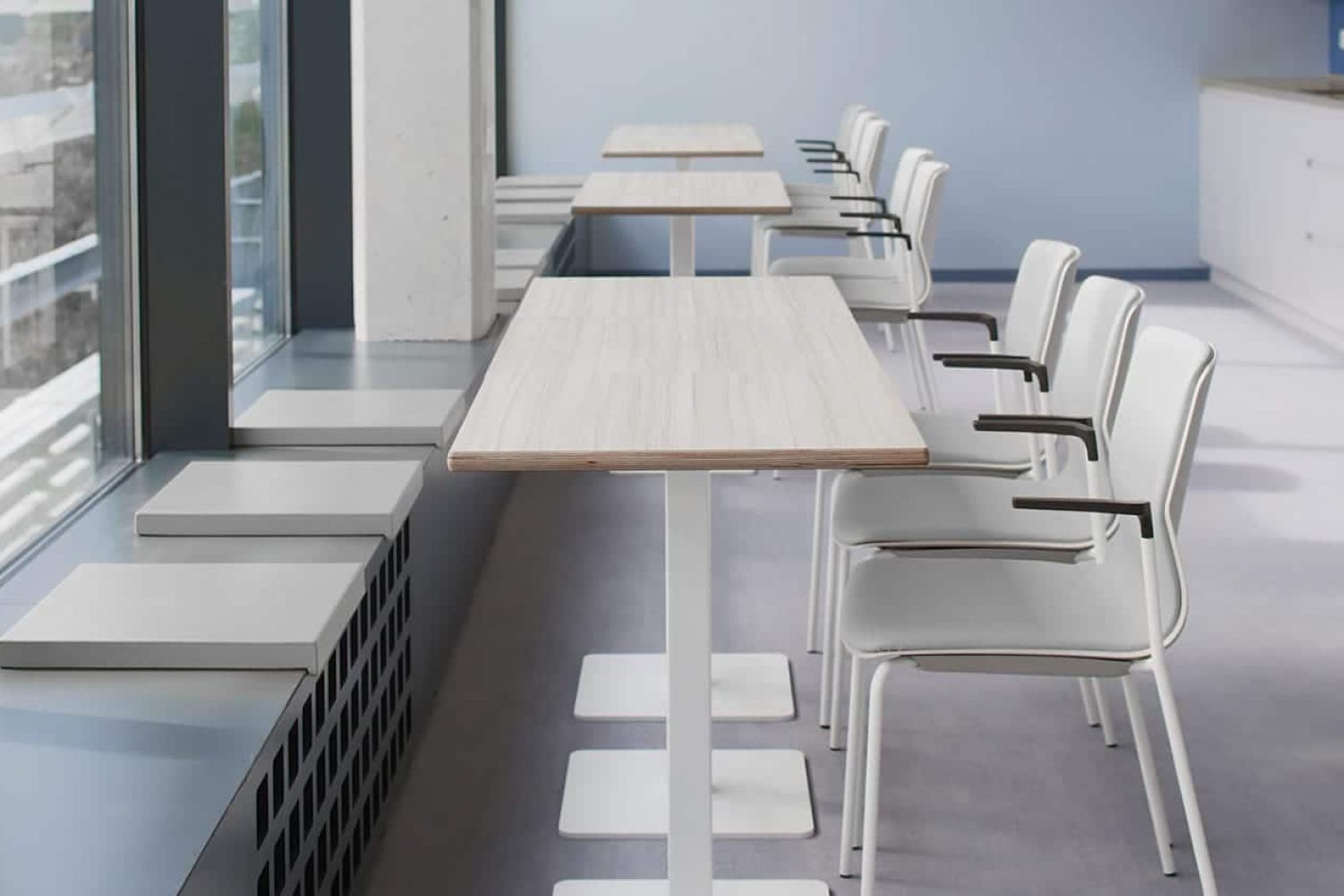 Canteen furniture, including window seats, pedestal tables and chairs