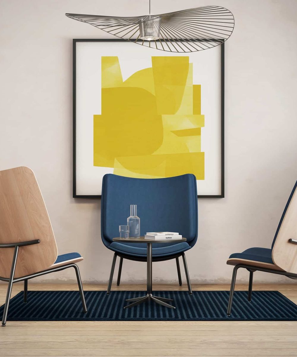 Three lounge chairs for offices in a room with a yellow painting.