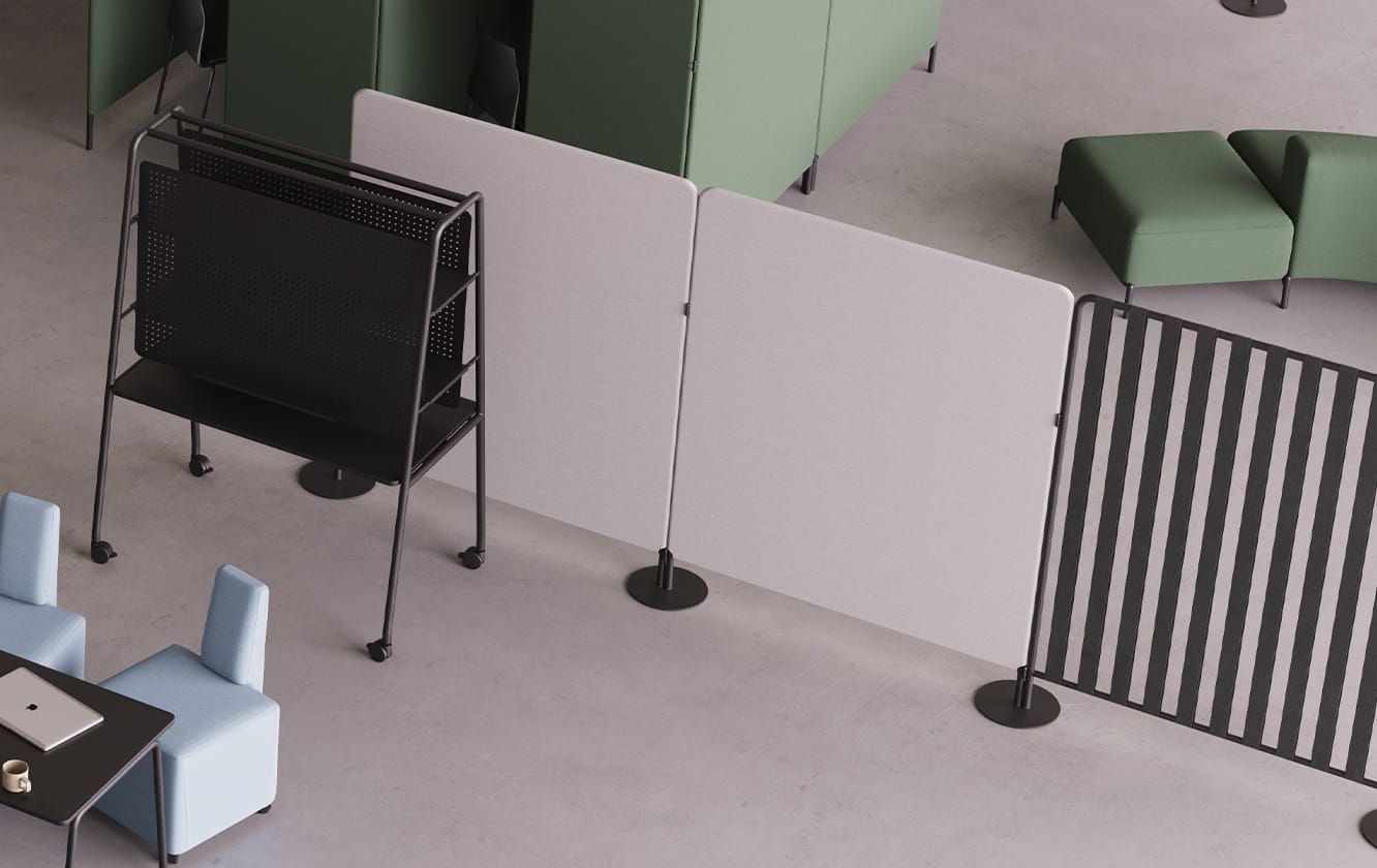 A room with a desk, chairs, and office screen dividers.