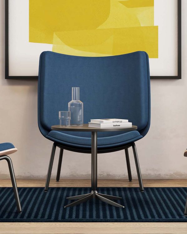 Three lounge chairs for offices in a room with a yellow painting.