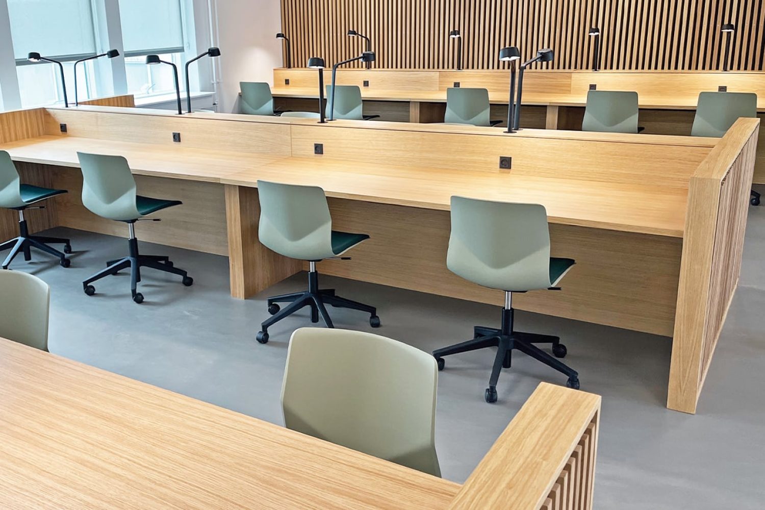 Study booths, desk workstations and chairs in a study hall