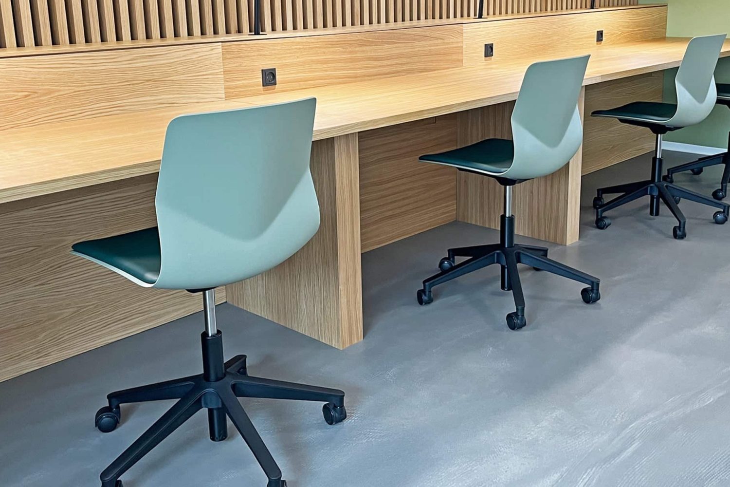 Study booths, desk workstations and chairs in a study hall