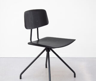 A black wooden office chair without arms on a black metal base.