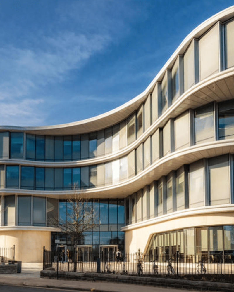 A modern office building with curved glass windows at the University of Sheffield