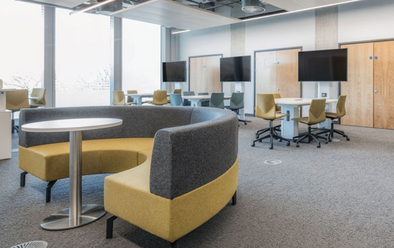 A conference room with Ocee and Four Design office furniture including yellow chairs and tables at the University of Sheffield.
