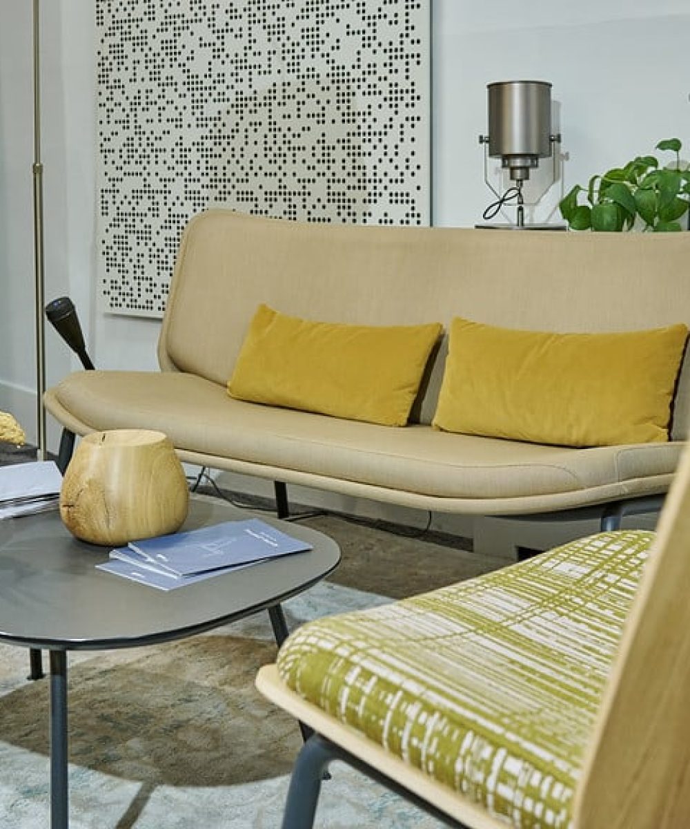 A living room with a sofa, chairs and a coffee table.