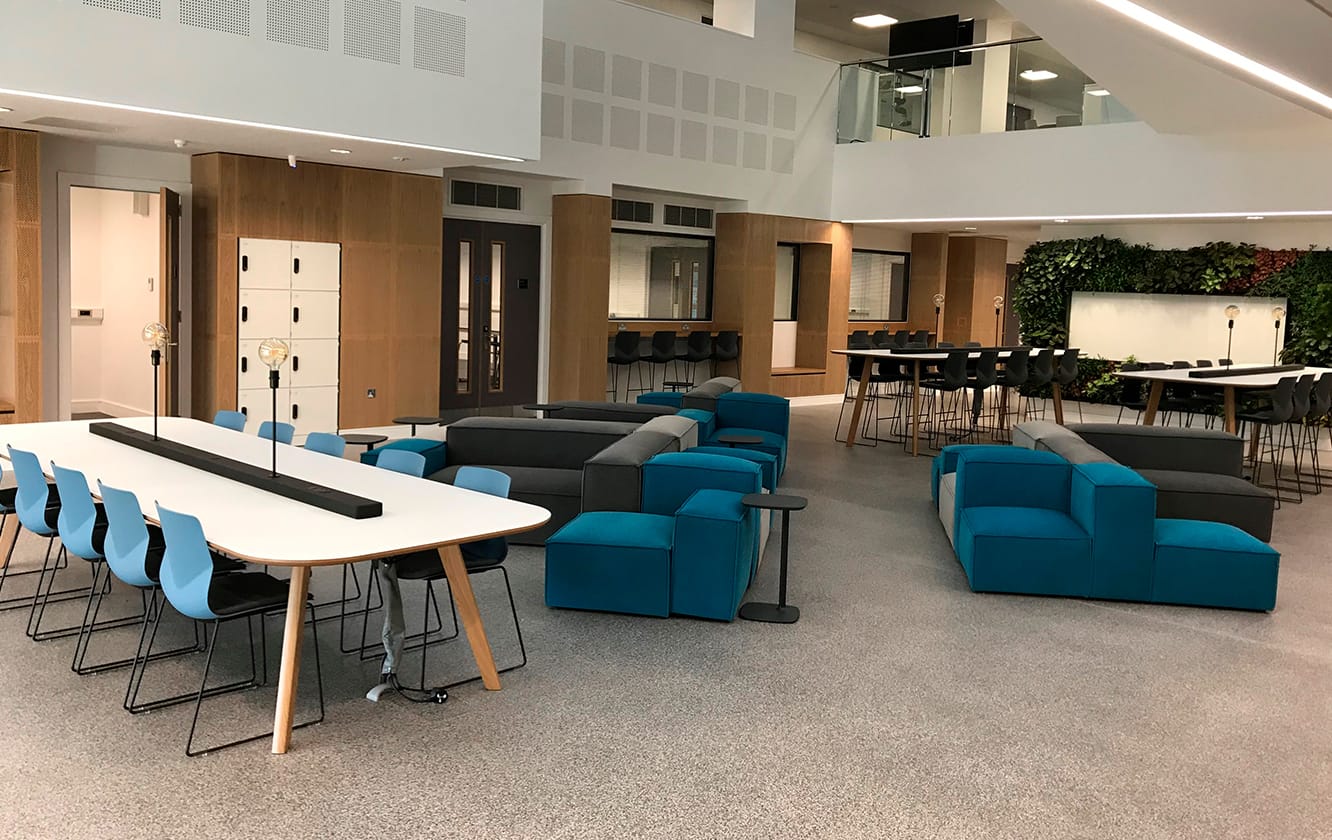 A conference room with Ocee and Four Design blue chairs and tables at Coventry University