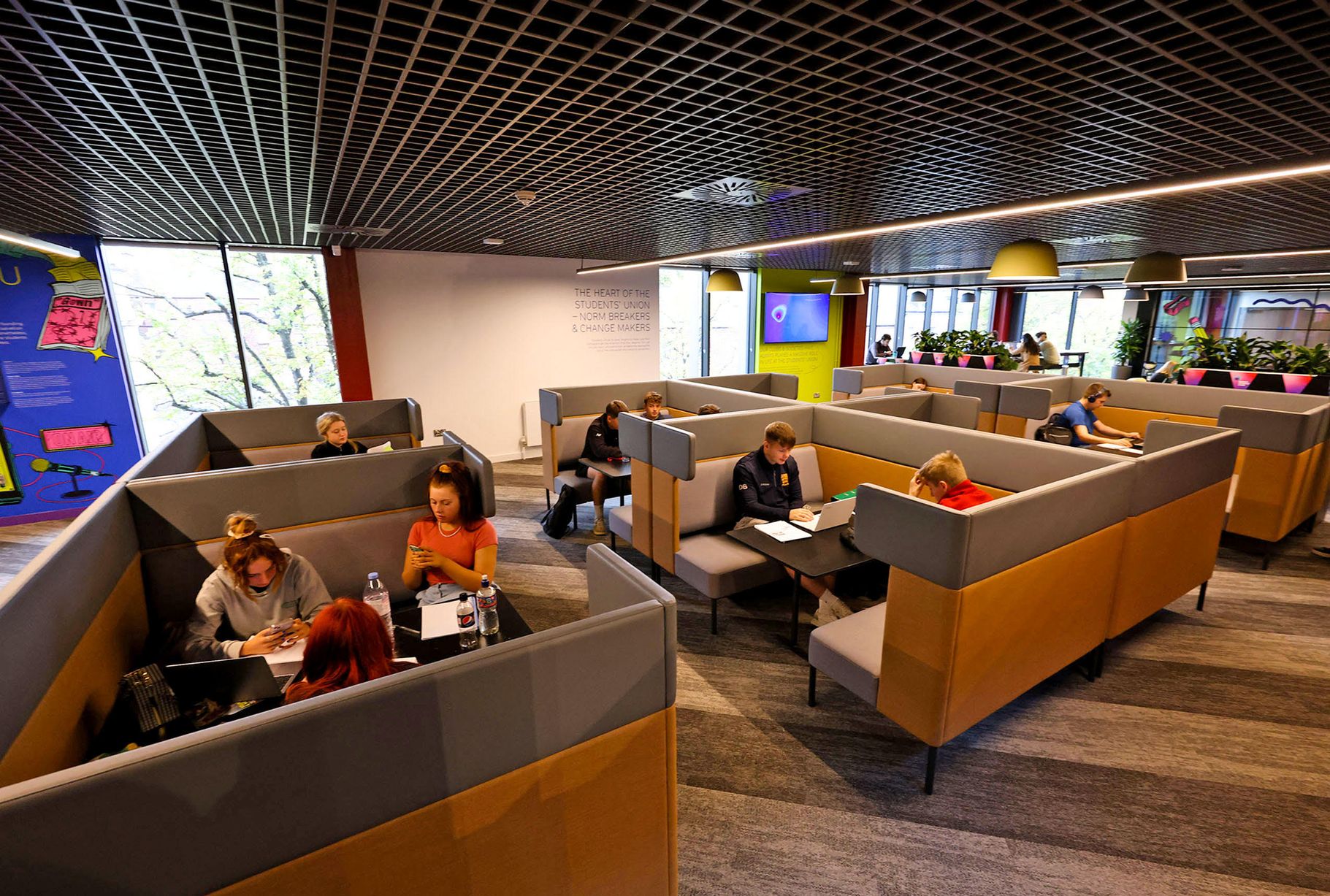 A group of people sitting in a conference room.