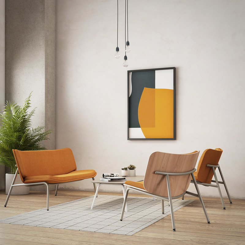 A living room with orange chairs and a painting on the wall.