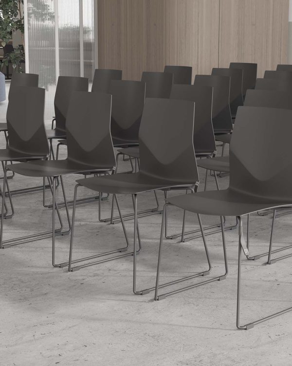 A row of gray chairs in a room.
