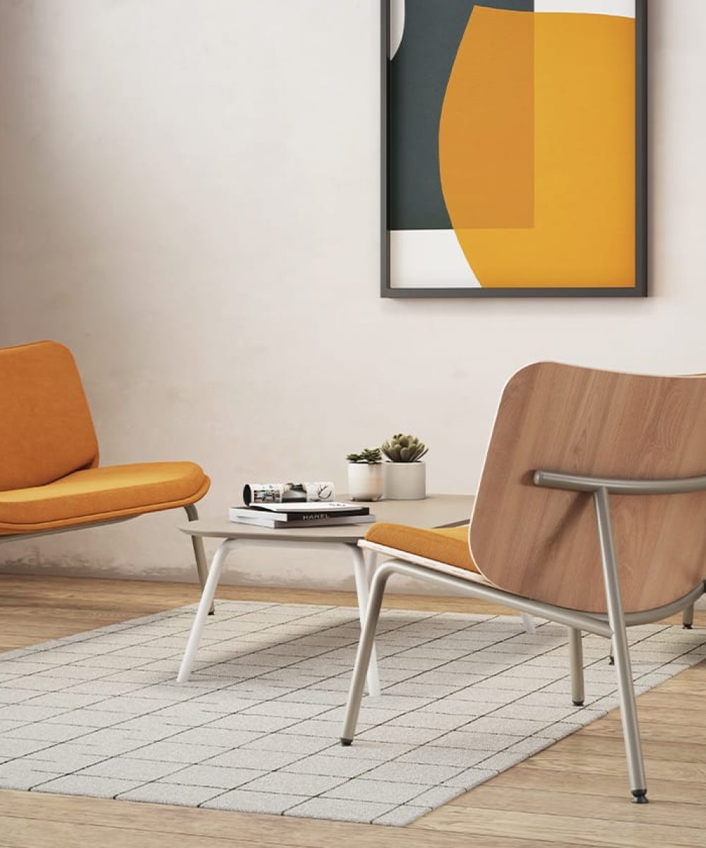 Three orange lounge chairs for offices in a room with a painting on the wall.