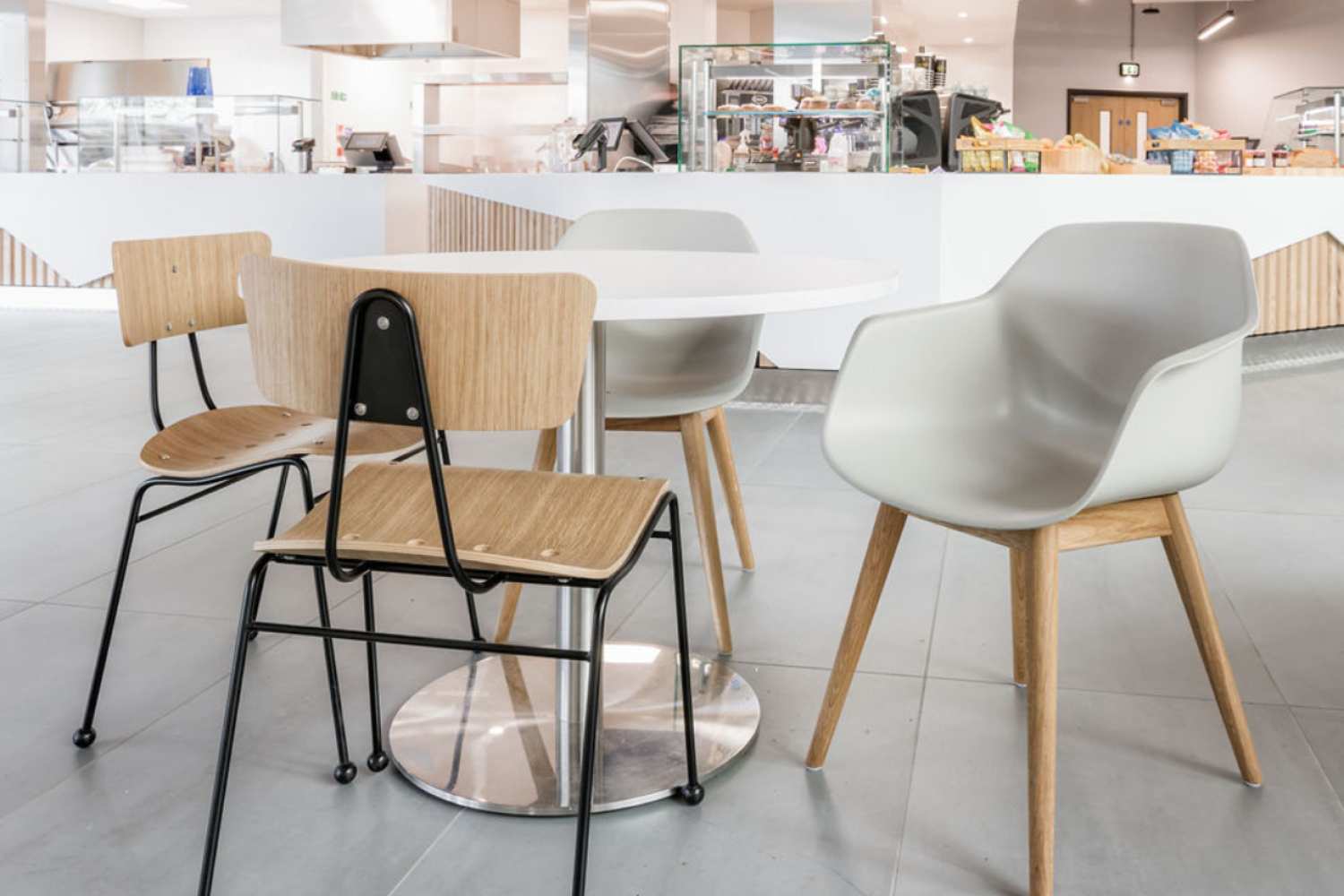 A white Ocee and Four Design table and chairs in a cafeteria at the University of Sheffield