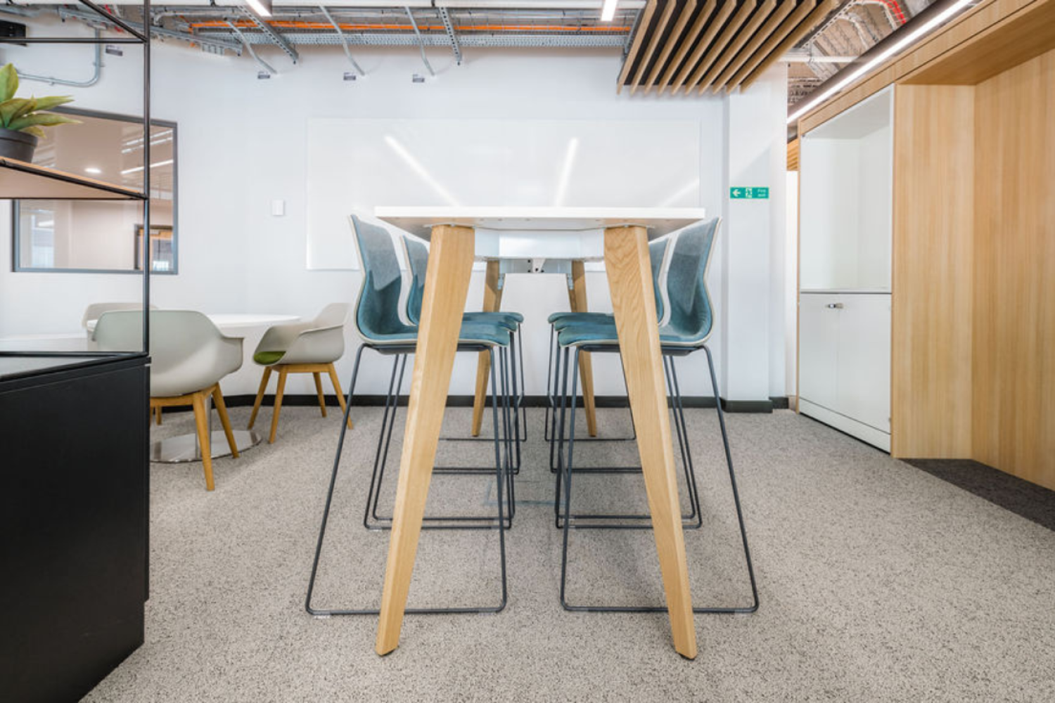 A conference room Ocee and Four Design office furniture including a table and chairs at the University of Sheffield.